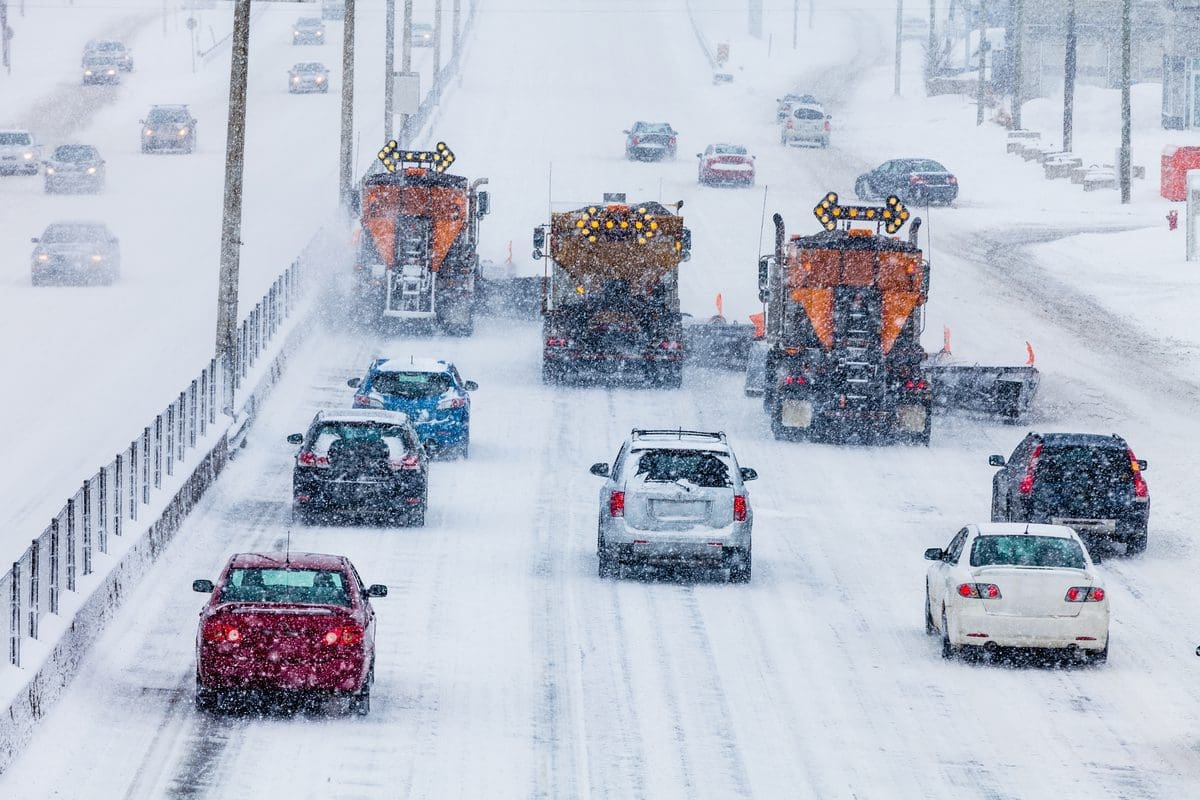 Snow plows on a high-way stock